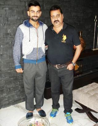 Virat Kohli with his coach Raj Kumar Sharma
