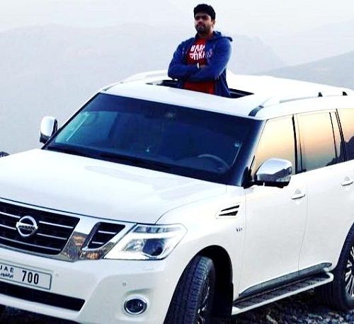 Aakash Kumar Sehdev poses with his car Nissan Pathfinder
